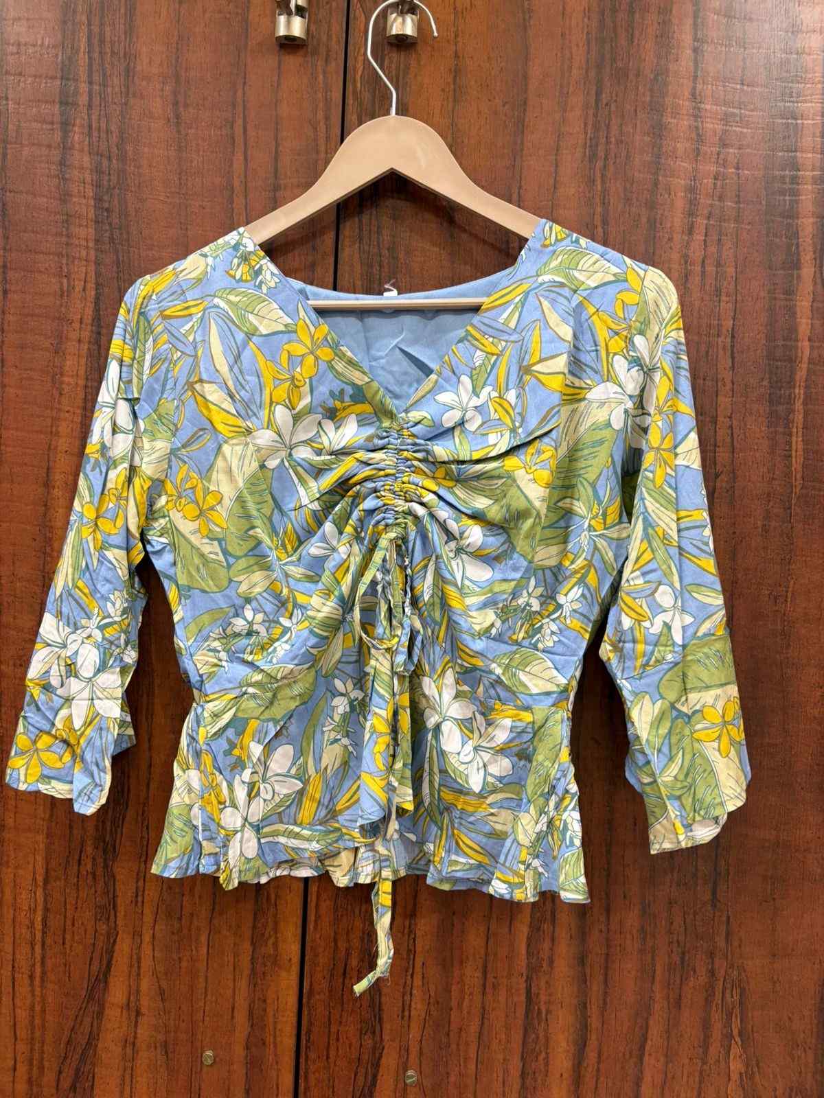 Peplum adjustable top