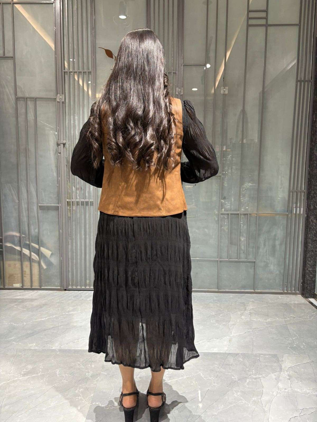 Black midi dress with leather jacket